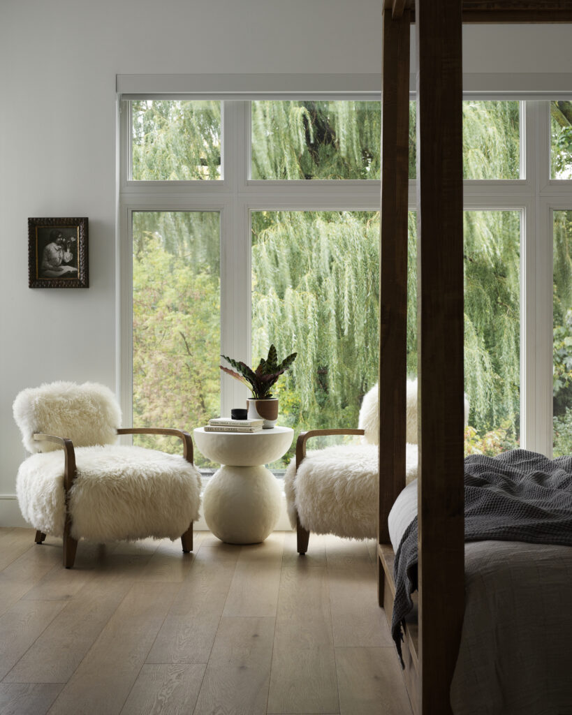 modern bedroom with fluffy white chairs